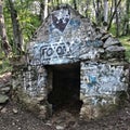A concrete structure with graffiti on the slope of Mount Beshtau. Royalty Free Stock Photo