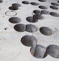 Concrete surface with cut round holes