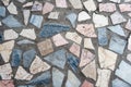 Concrete surface with multiple patches of colored stones Royalty Free Stock Photo