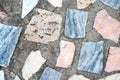 Concrete surface with multiple patches of colored stones Royalty Free Stock Photo