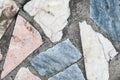 Concrete surface with multiple patches of large colored stones. Closeup Royalty Free Stock Photo