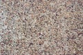 Concrete surface with small pebbles. Small stone wall texture for background. Royalty Free Stock Photo