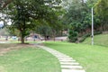 Concrete tile walkway in lawn at city park garden ,Outdoor cement brick tiled road