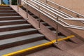 Concrete tiled stairs with steel ramp for disabled people