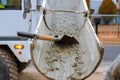 Concrete truck with pouring cement during to residential street Royalty Free Stock Photo