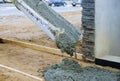 Concrete truck with pouring cement during to residential street Royalty Free Stock Photo