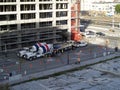 Concrete trucks, Construction machines, and people works at High-rise Construction site