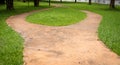 concrete walk way surrounded by green grasses Royalty Free Stock Photo