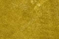 Concrete wall airbrushed with golden paint Royalty Free Stock Photo