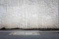Concrete wall and asphaltic road Royalty Free Stock Photo