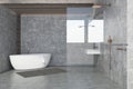 Concrete wall bathroom interior, white tub Royalty Free Stock Photo