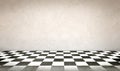 Concrete wall and checkerboard floor Royalty Free Stock Photo