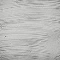 Concrete wall displaying subtle, sweeping horizontal brush strokes. The surface texture Royalty Free Stock Photo