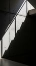 Concrete wall with distinct diagonal shadow formed by stairs and railing. The shadow Royalty Free Stock Photo