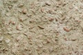 Concrete wall with granite pebbles. Royalty Free Stock Photo