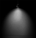 Concrete wall illuminated with spotlight projector. Royalty Free Stock Photo