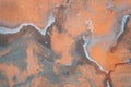 The concrete wall is painted coral or orange in streaks and faded Royalty Free Stock Photo