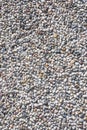 Concrete wall with pebbles in close-up. Royalty Free Stock Photo