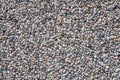 Concrete wall with pebbles in close-up. Royalty Free Stock Photo