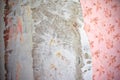 Concrete wall. Wall with tattered wallpaper. The concept of removing wallpaper and starting renovation Royalty Free Stock Photo