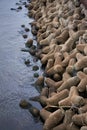 Concrete wave breakers along a coastal seawall Royalty Free Stock Photo