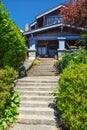 Concrete and wooden stairway to main entrance residential house