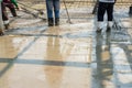 Concreters adjusting concrete mix. Royalty Free Stock Photo