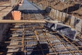 Concreting the base of the building. Construction worker Concrete pouring during commercial concreting floors of building in Royalty Free Stock Photo