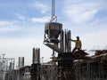 Concreting work by construction workers at the construction site.