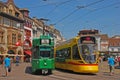 Concurrent moving tram on cable in Basel with different destination nearby station stop at busy BarfÃÂ¼sserplatz, Switzerland