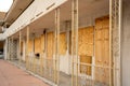 Condemned apartment building boarded up with plywood