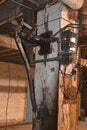 Condemned electronics, electrical wiring, and plumbing in a warehouse basement.