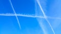 Condensation trails in a blue sky.