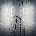 Of water droplets and rivulets forming streaks across the glass Royalty Free Stock Photo