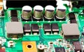 Condensator on green mother board Royalty Free Stock Photo