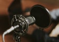 Condense microphone with a pop filter in a studio Royalty Free Stock Photo
