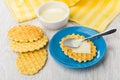 Condensed milk, napkin, wafer cookies with milk, spoon in saucer Royalty Free Stock Photo