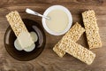 Condensed milk poured on puffed rice in saucer, bowl with condensed milk, puffed rice on table. Top view Royalty Free Stock Photo