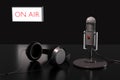 Condenser microphone, headphones and an unfocused sign with the text On Air. Royalty Free Stock Photo