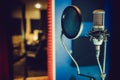 Condenser microphone in a recording studio, pop filter Royalty Free Stock Photo