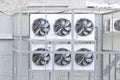 Condenser side of a ductless split-type air conditioner. Air conditioning condenser units outside a building Royalty Free Stock Photo