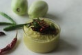 A condiment made of Green tomato, lentils, onions, chilly and garlic. Popularly known as green tomato chutney