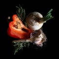 Still life, sweet pepper, garlic, onions on a dark background