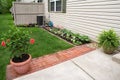 Condo Back Flower Garden with Red Brick Pavers