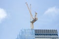 Condo building site with cranes and blue sky Royalty Free Stock Photo