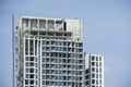 Condo building site with cranes and blue sky Royalty Free Stock Photo