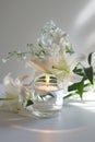 Condolence card with candle and white lilies