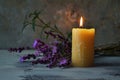 Condolence card with candles and purple flowers