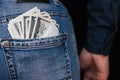 Condom and banknotes money dollars in back pocket men jeans Royalty Free Stock Photo