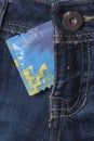Condom in the blue jeans Royalty Free Stock Photo